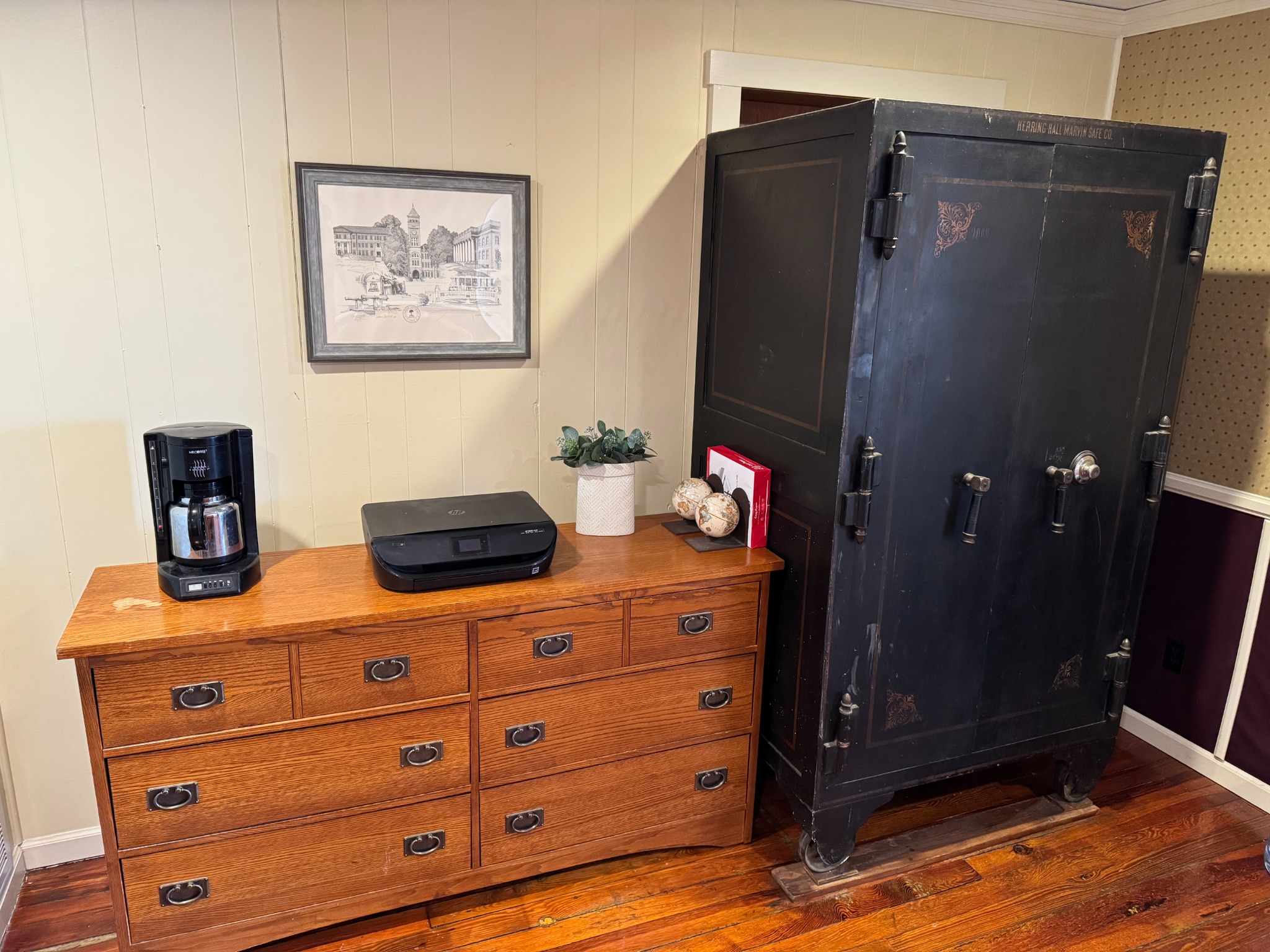 Hutchinson Yard coffee and printer station beside a historic black safe